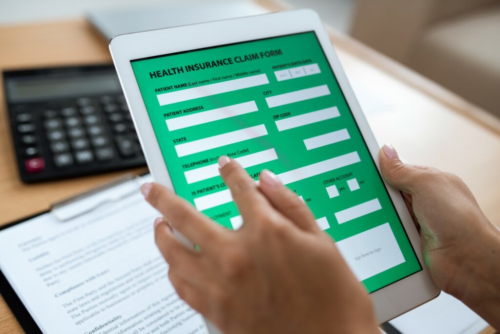 Image of electronic insurance claim form on a tablet.