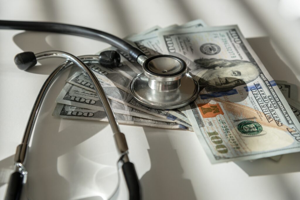 A stethoscope and money